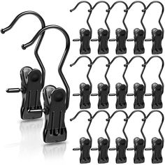 a bunch of black hooks and clips on a white background