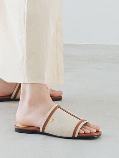 Editor's NotesSPUR's classic flat slides are wide so comfortable yet fashion-forward.- Light and natural canvas for comfort- Wearable daily for every look- Squared toe shape- Urethane cushion on the back insole- Non-slip thinly ribbed rubber outsole- Hand-madeMeasurements(in.)- Size: KR 225 MM - KR 250 MM- Heel Height: 0.39 in.Composition & Care- Canvas  Synthetic leather - Avoid direct heat and moisture- Do not wash- Avoid fire- Dry with a dry cloth when wet- Avoid direct sunlight- Pro Casual Beige Flat Slides, Classic Flat Slides For Spring, Beige Slip-on Slides For Spring, Spring Beige Slip-on Slides, Comfortable Slides For Everyday Spring Wear, Comfortable Everyday Slides For Spring, Casual Beige Slip-on Slides, Casual Everyday Slides, Everyday Spring Slip-on Slides