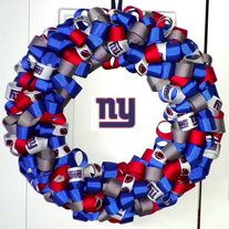 a new york giants wreath hanging on a door