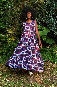 "A gorgeous tiered dress in a contemporary African print in a purple and white with dashes of deep green, blue and fuschia. The dress is tiered and full giving a swish which enhances the way the dress falls on the wearer. Wear with or without a belt. Closure is by a back zip with side pockets. A dress that will take you through the changing seasons. On warmer days wear with sandals or trainers and in cooler weather wear your boots, layer with a skinny long top and throw on your leather jacket or coat.  Partial lining at the upper part of the dress. 100% Cotton. Handmade in Ghana.  length of the dress is 56\"-57\"  Although we do our best to make sure that the colours displayed on our Website are accurate, the actual colours may vary. Differences in monitors and the device you use to view t Weather Wear, Bird Print, Purple And White, Changing Seasons, Tiered Dress, Deep Green, Dress Clothes For Women, Fall Dresses, African Print