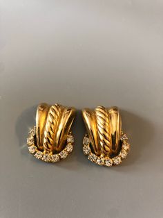 Stunning Goldtone Rhinestone Clip On Earrings. It is pre owned. Ships USPS first class mail. Clip On Earrings, Gold Tones, Etsy Earrings, Jewelry Earrings, Stud Earrings, Gold