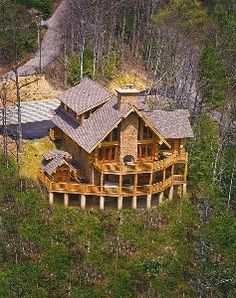 an aerial view of a house in the woods