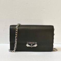 New With Tag Michael Kors Cece Medium Shoulder Crossbody Bag Clutch Vegan Leather Black Silver Toned Hardware 100% Authentic Retail: $448.00 Plus Tax *Please See The Measurement For The Size* Tag Said Medium But The Bag Is Small No Dust Bag Flap Closure Michael Kors Logo At Front Custom Fabric Lining 3 Card Slots 8.75" (L) X 5.5"(H) X 2.5"(D) Adjustable & Detachable Long Strap Very Clean, Smoke-Free And Pet-Free Environment. Black Flap Bag With Silver-tone Hardware For Travel, Chic Wallet On Chain With Branded Hardware, Formal Black Flap Bag With Silver-tone Hardware, Everyday Black Flap Bag With Silver-tone Hardware, Black Rectangular Flap Bag With Silver-tone Hardware, Black Flap Bag With Silver-tone Hardware For Everyday, Formal Black Wallet On Chain With Detachable Strap, Michael Kors Leather Shoulder Bag With Mobile Phone Holder, Michael Kors Leather Shoulder Bag With Phone Holder