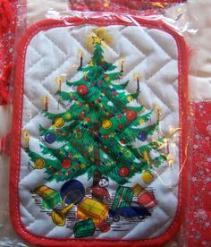 a quilted christmas tree with presents on it