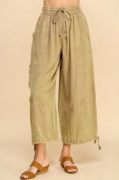 These Della Parachute Pants in Camel are perfect for both comfort and fashion. Constructed with a double gauze fabric, elastic and tie waist, they also have drawstring at ankle, they provide a relaxed fit for maximum breathability and mobility. Dress them up for a stylish look, or for an even more casual vibe. 100% cottonsmall rise 13" inseam 26" Full-length Relaxed Fit Parachute Pants With Elastic Waistband, Casual Full-length Parachute Pants With Elastic Waistband, Bohemian Cotton Ankle-length Parachute Pants, Cotton Wide-leg Parachute Pants With Drawstring, Beige Wide-leg Parachute Pants With Elastic Waistband, Double Gauze Fabric, Gauze Fabric, Double Gauze, Parachute Pants