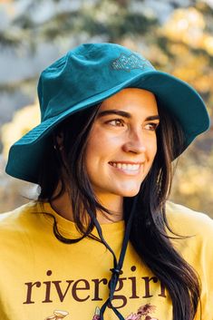 We are so excited for this new hat style and we hope you love it just as much as we do. Features all embroidered rivergirl design with a cotton drawstring. 100% cotton twill Blue Cotton Bucket Hat For Outdoor, Cotton Cap With Upf 50+ Protection, Cotton Cap With Upf 50+, Blue Cotton Sun Hat For Outdoor Use, Blue Cotton Sun Hat For Outdoor, Cotton Bucket Hat For Outdoor, Green Cotton Hat, Wide Brim Cotton Hat For Outdoor, Cotton Wide Brim Hat For Outdoor