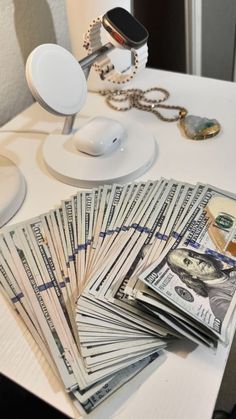 a bunch of money sitting on top of a table