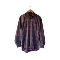 ○ This timeless vintage Nordstrom burgundy tartan plaid shirt features long sleeves, two chest pockets, and a classic button-up design. Perfect for a sophisticated yet casual look. ○ Material: 100% cotton ○ Size on the label: 15 - 33 ○ Measurements (taken flat) pit to pit: 23" sleeve length (from armpit seam): 21.5" shoulder seam: 20.5" total length (from the back neck): 34" ○ In great vintage condition. Some marks near the label. No other visible flaws. Please look at the pictures since they ar Classic Brown Long Sleeve Flannel Shirt, Classic Long Sleeve Plaid Tops, Fitted Plaid Flannel Shirt With Long Sleeves, Plaid Long Sleeve Flannel Shirt With Button Closure, Fitted Long Sleeve Flannel Shirt, Vintage Long Sleeve Flannel Shirt For Fall, Vintage Plaid Long Sleeve Flannel Shirt, Vintage Long Sleeve Flannel Shirt For Work, Vintage Flannel Workwear Shirt For Fall