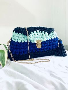 Handmade bag von crochet technique, dark blue, electric blue and pastel teal color. cotton cord and clip closure. Shoulder strap in steel chain. Colorful and soft, so capacious as to contain a book. Pastel Teal, Blue Electric, Handmade Bag, Bag Crochet, Teal Color, Crochet Techniques, Cotton Cord, Teal Colors, Steel Chain