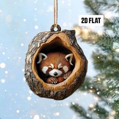 a christmas ornament with a red fox inside it's hole in the tree