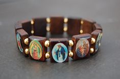 "Saints Bracelet,Catholic Christian Bracelet,Wood Bracelet,Jesus,Mary,Angels Saints Wood Beads,Bronze Beads,Man,Woman,Stretch The bracelet in the picture shown is 7\" size which fits an average wrist, please select your size from the drop down menu at checkout I will custom make your order, any questions please feel free to contact message me anytime, thank you very much. * * * * * * * * * * * * * * * * * * * * * * * * * * * * * * * * * * Choosing Sizes: Sizes are actual wrist measurement, not t Saints Bracelet, Jesus Bracelet, Catholic Bracelet, Christian Bracelets, Wood Bracelet, Unusual Jewelry, Wood Beads, Turquoise Bracelet, Jewelry Bracelets