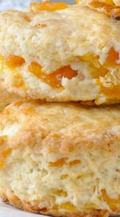 three biscuits with orange fillings stacked on top of each other