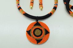 Unique African Maasai Handcrafted Beaded Necklace with an Elegant Look and Brilliant Finish.**GET FREE SHIPPING FOR ADDITIONAL ITEMS PURCHASED.Size(Around the Neck)-16 Inches.Color-Orange, Black, and Gold.Get a pair of Matching Earrings and 2 Bracelets for an extra $7.Yes, Buy Multiple Items and pay shipping for 1 item only- The rest ships Free. (No Limits on the number of Multiple items). With a faster delivery time of 3 days via DHLExpress, Worldwide. Ordinary/Standard Shipping also available Traditional Orange Beaded Necklaces With Round Beads, Traditional Orange Beaded Necklace As Gift, Traditional Orange Beaded Necklace For Gifts, Orange Necklace With Black Beads For Gift, Gift Necklace With Orange And Black Beads, Traditional Orange Jewelry With Black Beads, Orange Necklace With Black Round Beads, Unique Orange Necklace With Large Beads, Black African Necklace