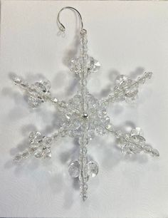 a crystal snowflake hanging from a hook