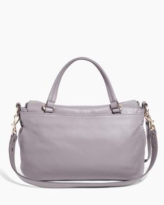 Designed for those who appreciate an effortless grab-and-go aesthetic, this shoulder bag exudes quiet luxury. Featuring the same detailing as the mini version but in a larger size, it incorporates a true handle with an optional, shoulder strap. The flap has a decorative dog clip with a magnetic snap for security. This modern, feminine take on traditional briefcases combines the elements of a contemporary messenger bag with a convenient top handle. Glove Tanned Leather Signature branded hardware Luxury Everyday Satchel Bag With Top Carry Handle, Luxury Everyday Satchel With Top Carry Handle, Everyday Flap Bag With Detachable Top Handle, Everyday Double Handle Flap Bag, Travel Top Handle Flap Bag, Versatile Shoulder Bag With Detachable Strap And Top Handle, Versatile Shoulder Bag With Detachable Strap, Versatile Top Handle Shoulder Bag With Detachable Strap, Chic Everyday Luxury Crossbody Satchel