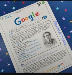 a close up of a fake google id on a blue surface with stars in the background