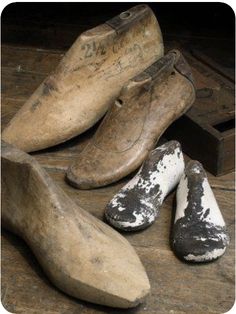 old wooden shoes are sitting on the floor