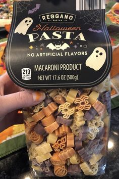 someone is holding up a bag of macaroni and cheese halloween pasta for the camera