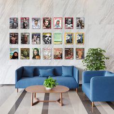 a living room filled with blue couches next to a wall covered in pictures on it