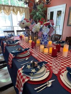 the table is set with red, white and blue place settings