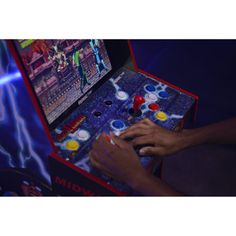 a close up of a person playing a game on a video game console with lightning in the background