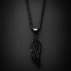 Our Black Wing Necklace features our Signature All Black Wing Pendant and a Black Box Chain. Some well-picked accessories can make all the difference when you are trying to upgrade your outfit, so don’t overlook The Black Wing Necklace which is built to last. Perfect when worn on it's on or with other pieces of black jewelry, level up any outfit today. - Size: One Size 56cm (23") Black Stainless Steel Jewelry With Black Enamel, Black Metal Necklace With Chain, Black Metal Pendant Chain Necklace, Black Pendant Necklace With Chain, Black Pendant Necklace For Formal Occasions, Elegant Black Stainless Steel Chain Necklace, Black Pendant Chain Necklace Gift, Black Box Chain Necklace For Formal Occasions, Black Box Chain Necklace For Formal Events