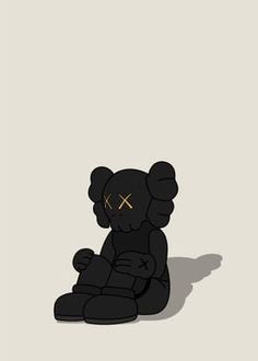 a black teddy bear sitting on the ground with gold crosses painted on it's face