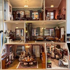 the inside of a doll house with furniture and accessories in it's display case