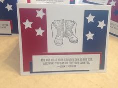 a card with an image of boots and stars on it, which reads ask not what your country can do for you