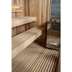 the inside of a wooden sauna with two benches