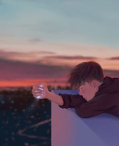 a young boy leaning on a wall with his arm out and looking at the sky