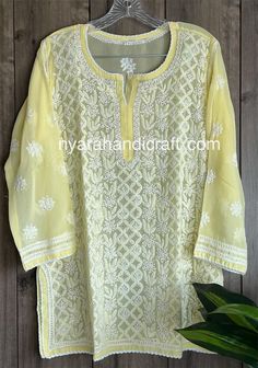 Chikankari hand embroidered kurti top on georgette.  Intricate hand embroidery with 'Mukaish' add ons.  Length: 30 inches Sleeves: 3/4 th Liner included Chanderi Resham Embroidery Straight Kurta Top, Straight Kurta Top With Resham Embroidery In Chanderi, Festive Georgette Top With Intricate Embroidery, Georgette Tops With Chikankari Embroidery For Wedding, Wedding Tops With Chikankari Embroidery On Georgette, Embroidered Straight Kurta Top In Chanderi, Embroidered Chanderi Straight Kurta Top, Designer Chikankari Embroidery Blouse For Eid, Eid Chanderi Top With Resham Embroidery