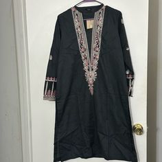 Material Is Jacquard And Embroidery Is On Sleeves And Neckline. Brand Is Sapphire Pk Casual Black Festive Kurta, Black Embroidered Fabric With Border For Eid, Black Embroidered Fabric With Embroidered Border For Eid, Black Unstitched Embroidered Fabric With Border, Unstitched Black Embroidered Fabric With Embroidered Border, Elegant Black Cotton Traditional Wear, Black Long Sleeve Kurta For Spring, Black Chikankari Embroidered Fabric For Eid, Embroidered Casual Kurta For Festive Occasions