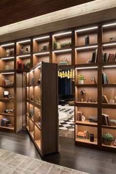 an open bookcase with many books on it