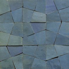 a close up view of some blue tiles