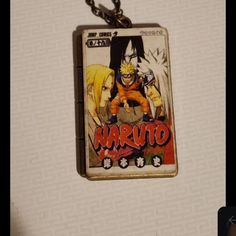 a keychain with an image of naruto hanging from it's side