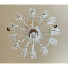 a chandelier hanging from the ceiling in a room