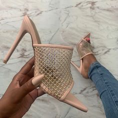 The perfect shoe to complement your summer glow! A great style to switch easily from day to night. This nude mule style boasts a light shimmer and sparkle. Your shoes are bound to take the spotlight! Available in half sizes. Recommend going up a half size. Available only in nude. Details -High heel mule -Pointy toe -Stiletto heel -Netted sparkle detail Materials -Upper: Faux leather Measurements -Heel Height: 4.5'' Shoes Closet, Cute Shoes Heels, High Heel Mules, Summer Glow, Your Shoes, Day To Night, Shoe Closet, Bellini, Closet Design