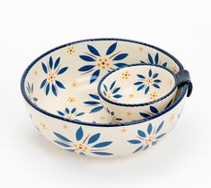 two blue and white bowls with flowers on them