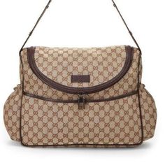 a gucci bag with brown trimmings on the front and bottom part of it