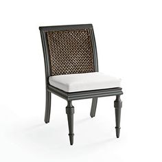 a black and white chair with a cushion on it's backrest, against a white background