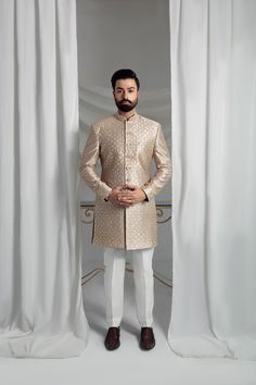 Elevate your formal attire with our Beige Prince Coat. Made from pure atlas material, this coat boasts a luxurious pure silk lining, perfect for any special occasion. The included raw silk kurta pajama and shawl, featuring embroidered borders, complete the elegant look. 4-Piece Suit Elegant Semi-formal Sets For Eid, Fitted Tissue Silk Long Sleeve Kurta, Designer Straight Kurta Bandhgala For Ceremonial Occasions, Designer Ceremonial Bandhgala With Straight Kurta, Fitted Long Sleeve Tissue Silk Kurta, Formal Festive Bandhgala With Resham Embroidery, Formal Bandhgala With Resham Embroidery For Festive Occasions, Fitted Silk Nehru Jacket Straight Kurta, Fitted Silk Nehru Jacket