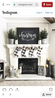 a fireplace decorated for christmas with stockings hanging from the mantel and potted plants