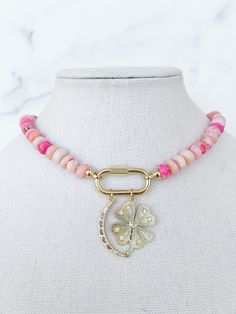 Take a look at this stunning Pink Opal Hand Knotted Necklace! This piece is one of a kind and something you'll never want to take off. The closure is located in the front and it is accessorized with two beautiful charms. You can take them off to wear a charmless necklace or add your own for even more fun!  This style comes in blue or green opals.  Details: + Beautiful Pink, Blue, or Green Opal Beaded Necklace  + Carabiner clasp (front) + Large Silver Heart Pendant + Nickel Free + Hypoallergenic + Sold as 1 Necklace Measurements: + 17" with clasp (front)  Please contact us with any questions! We are here and happy to assist you! * * * * * * * * * * * * * HOW TO CARE FOR YOUR JEWELRY + All gold and rhodium electroplated jewelry is plated with the highest quality and has a secondary coating w Necklace Carabiner, Electroplated Jewelry, Pink Opal Jewelry, Pink Stone Necklace, Four Leaf Clover Charm, Necklace Measurements, Custom Charm Necklaces, Hand Knotted Necklace, Knotted Necklace