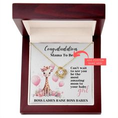 a necklace in a wooden box with an inscription on the front saying congratulations mama to be