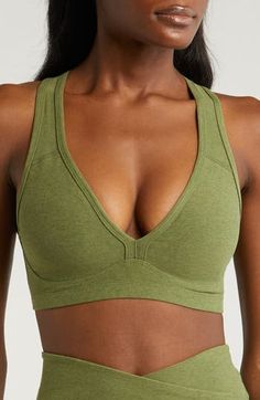 Support and style go hand in hand on this medium-impact sports bra that gives you one more reason to look forward to getting to class. Medium-impact support Removable soft cups Partially lined 87% polyester, 13% elastane Machine wash, tumble dry Made in the USA of imported fabric Beyond Yoga, Soft Cup, Hand In Hand, Moss Green, Bra Lingerie, To Look, That Look, Sports Bra, Nordstrom