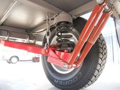 the rear end of a vehicle with its brake assembly on it's flatbed