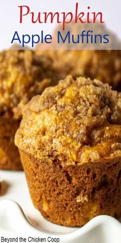 two muffins sitting on top of a white plate with the title pumpkin apple muffins