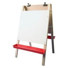 an easel with a red bench underneath it and a white board on the back