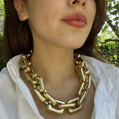 Make a bold statement with this stunning gold resin link chain necklace. Designed for those who embrace daring fashion, this lightweight piece offers a striking contrast that effortlessly elevates any outfit. Whether paired with a casual white t-shirt or dressed up for a business lunch, its versatile design ensures you stand out with confidence. A timeless accessory, this necklace is a must-have for anyone who adores statement jewelry with a classic edge. Avoid contact with water and cosmetics, Bold Jewelry With Chain For Parties, Bold Chunky Chain Jewelry For Party, Bold Chunky Chain Necklace For Party, Bold Chain Jewelry For Party, Bold Chunky Chain Party Jewelry, Trendy Chunky Chain Necklace For Party, Bold Party Jewelry With Chunky Chain, Bold Party Jewelry With Chain Detail, Bold Chain Link Jewelry For Party